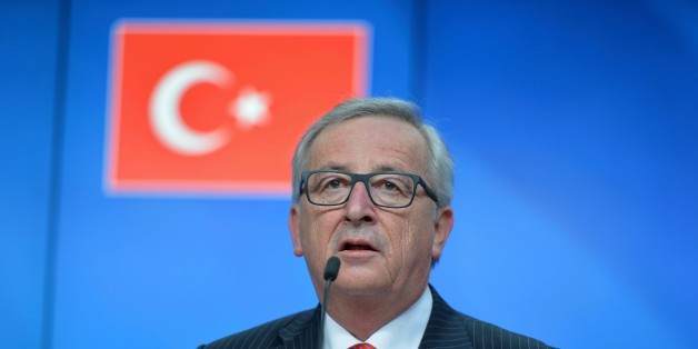 BRUSSELS, BELGIUM - MARCH 18: President of the European Commission, Jean-Claude Juncker delivers a speech during a joint press conference with President of the European Council, Donald Tusk (not seen) and Turkish Prime Minister Ahmet Davutoglu (not seen) after the Turkey-EU Heads of State or Government summit as part of the European Union Leaders Summit in Brussels, Belgium on March 18, 2016. (Photo by Dursun Aydemir/Anadolu Agency/Getty Images)