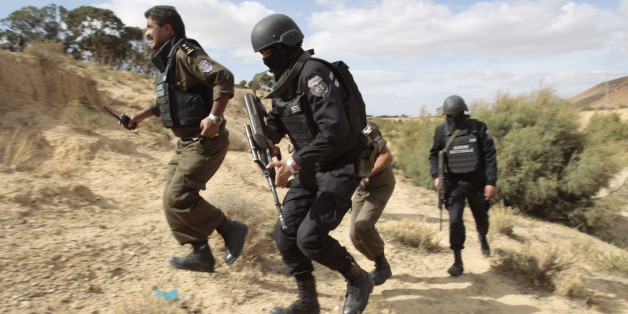 Tunisian police patrol a mountain in Kasserine October 23, 2014. The Chaambi, Saloum and Sammama mountains bordering with Algeria have become a refuge for militant groups over the past two years, turning Kasserine into a military barracks encircled by roadblocks to curb attacks. Picture taken October 23. To match story TUNISIA-ELECTION/ REUTERS/Zoubeir Souissi (TUNISIA - Tags: POLITICS CIVIL UNREST)