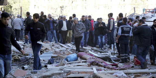People view the damage from an explosion in southeastern Turkish city of Diyarbakir, early Friday, Nov. 4, 2016. A large explosion hit the largest city in Turkey's mainly Kurdish southeast region on Friday, wounding several people, the state-run Anadolu Agency reported. Turkish authorities have imposed a temporary blackout on coverage of the blast occurred in Diyarbakir on Friday, citing public order and national security reasons. (AP Photo/Mahmut Bozarslan)