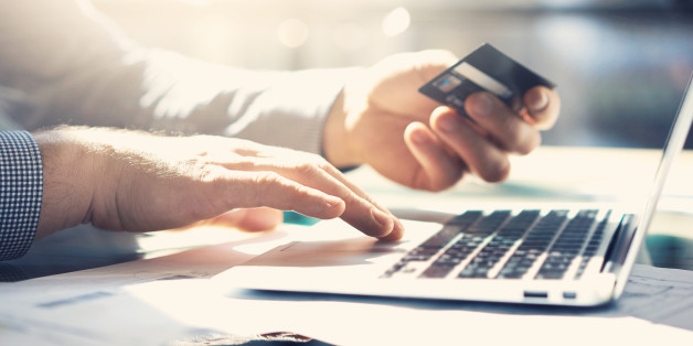 Closeup businessman working with generic design notebook. Online payments, hands keyboard. Blurred background, film effect