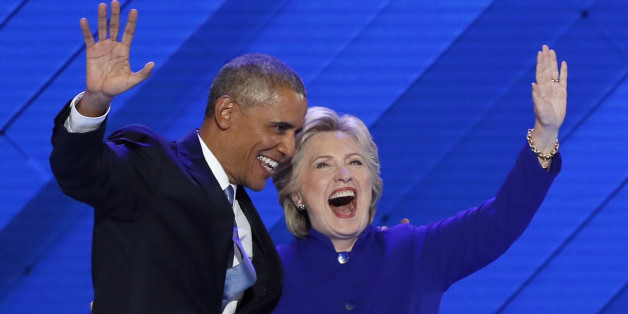 U.S. President Barack Obama and Democratic presidential nominee Hillary Clinton appear onstage together after his speech on the third night at the Democratic National Convention in Philadelphia, Pennsylvania, U.S. July 27, 2016. REUTERS/Mike Segar