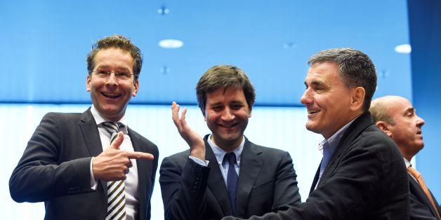 Dutch Finance Minister and president of Eurogroup Jeroen Dijsselbloem (L) talks with Greek Finance Minister Euclid Tsakalotos (R) next to a Greek advisor during an Eurogroup meeting in Luxembourg on October 10, 2016.
Greece has delivered the reforms necessary to unlock 2.8 billion euros in rescue loans from its massive third bailout, the European Commission's top economics affairs official said on October 10, 2016. / AFP / JOHN THYS (Photo credit should read JOHN THYS/AFP/Getty Images)