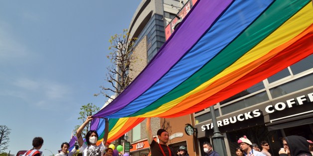 Supporters of the lesbian, gay, bisexual and transgender community (LGBT) carry a rainbow banner as they take part in the 'Tokyo Rainbow Pride' parade in Tokyo on April 27, 2014. Organisors said some 14,000 supporters of the LGBT community, many in costume, marched in Tokyo's Shibuya and Harajuku shopping districts. AFP PHOTO / Yoshikazu TSUNO (Photo credit should read YOSHIKAZU TSUNO/AFP/Getty Images)