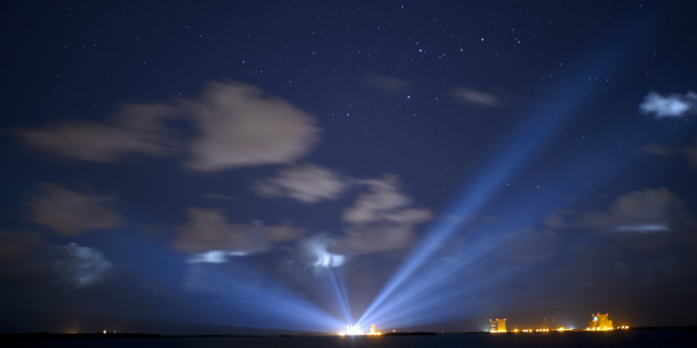 CAPE CANAVERAL, FL - SEPTEMBER 7: In this handout photo provided by NASA, the United Launch Alliance Atlas V rocket with NASA's Origins, Spectral Interpretation, Resource Identification, Security-Regolith Explorer (OSIRIS-REx) spacecraft on board is seen illuminated in the distance in this thirty second exposure on September 7, 2016 at Cape Canaveral Air Force Station in Florida. OSIRIS-REx is scheduled to launch on Sept. 8 and will be the first U.S. mission to sample an asteroid, retrieve at least two ounces of surface material and return it to Earth for study. The asteroid, Bennu, may hold clues to the origin of the solar system and the source of water and organic molecules found on Earth. (Photo by Joel Kowsky/NASA via Getty Images)