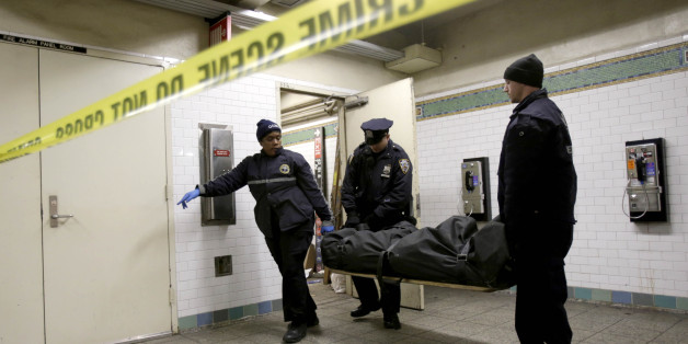 A police officer and medical examiner personnel carry a body out of a Times Square subway station in New York, Tuesday, Jan. 22, 2013. Authorities say a man has died after he was struck by a subway train in Times Square. Witnesses told police that the man jumped into the trainâs path. Transit spokeswoman Judie Glave says the incident around 10 a.m. Tuesday involved a No. 2 train. (AP Photo/Seth Wenig)