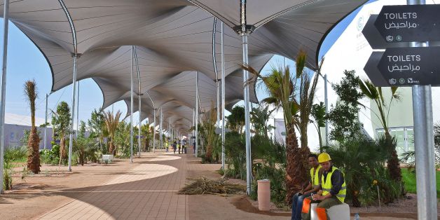 Moroccan labourers sit at the site of the COP22 international climate conference in Marrakesh on October 31, 2016, a week before the start of the talks. The organisation committee of the COP22 announced on November 2, 2016 that the site of the event which consists of 55 tents is nearly ready. / AFP / STRINGER / TO GO WITH AFP STORY BY JALAL AL-MAKHFI (Photo credit should read STRINGER/AFP/Getty Images)