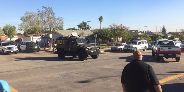 This photo provided by Marco Soto shows police vehicles outside a middle school in Asuza, Calif., on Tuesday, Nov. 8, 2016, following reports of a shooting near the Los Angeles-area polling site. (Marco Soto/@warzoneintro via AP)