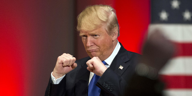 FILE - In this Jan. 28, 2016, file photo, Republican presidential candidate Donald Trump poses with a ring given to him by a group of veterans during a campaign event on the campus of Drake University in Des Moines, Iowa. (AP Photo/Jae C. Hong, File)