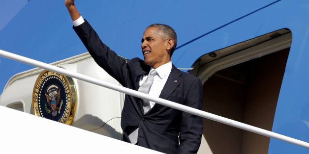 U.S. President Barack Obama waves as he boards Air Force One as he departs for a Hillary for America campaign event in Orlando, Florida, from Andrew Air Force Base in Maryland, U.S., October 28, 2016. REUTERS/Joshua Roberts