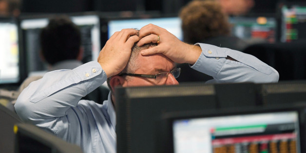 Traders at BGC Partners look at screens after Donald Trump won the U.S. Presidential election, in London, Britain, November 9, 2016. REUTERS/Toby Melville TPX IMAGES OF THE DAY