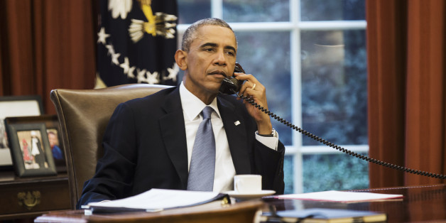 U.S. President Barack Obama speaks on the phone with Saudi Arabia's King Abdullah from the Oval Office of the White House in Washington September 10, 2014. President Barack Obama called Saudi Arabia's King Abdullah on Wednesday ahead of an evening speech in which the U.S. leader plans to lay out his strategy for defeating the militant group Islamic State, the White House said. REUTERS/Kevin Lamarque (UNITED STATES - Tags: POLITICS CIVIL UNREST CONFLICT TPX IMAGES OF THE DAY)