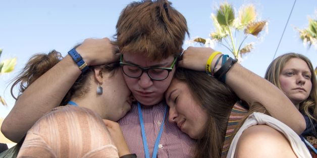 American students react as they take part in a protest outside the UN climate talks during the COP22 international climate conference in Marrakesh in reaction to Donald Trump's victory in the US presidential election, on November 9, 2016.
Stunned participants at UN climate talks in Marrakesh insisted that climate change denier Donald Trump cannot derail the global shift to clean energy, although some called his victory in US presidential elections a 'disaster'. / AFP / FADEL SENNA (Photo credit should read FADEL SENNA/AFP/Getty Images)