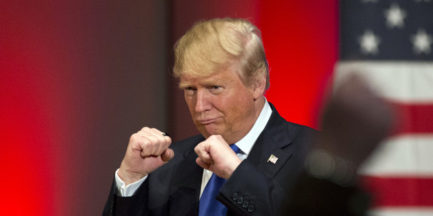 FILE - In this Jan. 28, 2016, file photo, Republican presidential candidate Donald Trump poses with a ring given to him by a group of veterans during a campaign event on the campus of Drake University in Des Moines, Iowa. (AP Photo/Jae C. Hong, File)