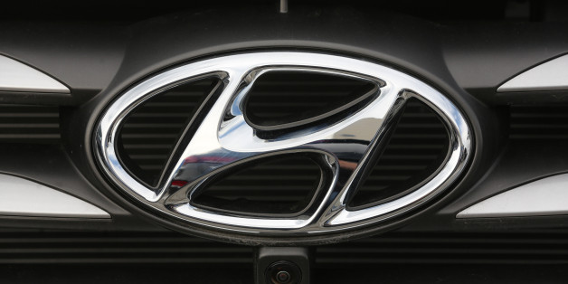 A badge sits on the front grill of an Hyundai Motor Corp. automobile in a parking lot outside the Avtotor auto assembly plant in Kaliningrad, Russia, on Tuesday, Aug. 2, 2016. South Korea's largest automaker expects unfavorable market conditions on Brexit-related uncertainties and continued slowdown in emerging markets, Choi Byung Chul, Hyundai Motor Corp.'s chief financial officer, said on a conference call. Photographer: Andrey Rudakov/Bloomberg via Getty Images
