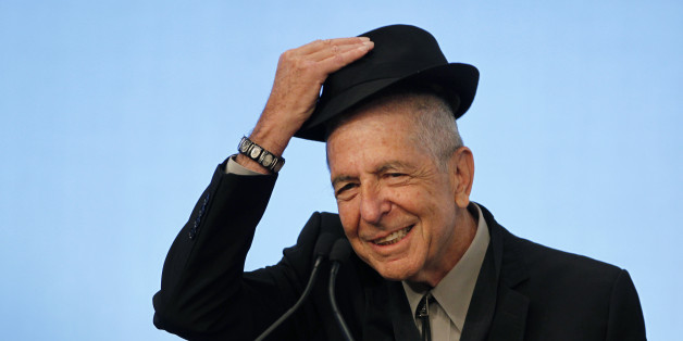 Musician Leonard Cohen tips his hat to the audience as he accepts the 2012 Awards for Song Lyrics of Literary Excellence, which was awarded to both he and Chuck Berry at the John F. Kennedy Presidential Library and Museum, in Boston, Massachusetts, U.S. on February 26, 2012. REUTERS/Jessica Rinaldi/File Photo