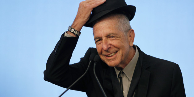 Musician Leonard Cohen tips his hat to the audience as he accepts the 2012 Awards for Song Lyrics of Literary Excellence, which was awarded to both he and Chuck Berry at the John F. Kennedy Presidential Library and Museum, in Boston, Massachusetts, U.S. on February 26, 2012. REUTERS/Jessica Rinaldi/File Photo