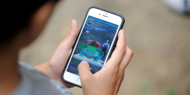 Gianni Vitora, 11, plays Pokemon Go as he and his family enjoy the mild weather at the start of the Labor Day weekend ahead of potential storms on the east coast of the United States caused by Tropical Storm Hermine New York, U.S., September 3, 2016. REUTERS/Mark Kauzlarich