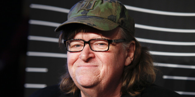 FILE - In this May 16, 2016 file photo, Michael Moore attends the 20th Annual Webby Awards at Cipriani Wall Street in New York. Moore premiered a surprise film about the U.S. presidential election on Tuesday, Oct. 18, 2016. "Michael Moore in TrumpLand" features a one-man stage show of Moore discussing the race. (Photo by Andy Kropa/Invision/AP, File)