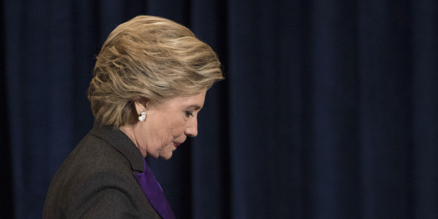 Democratic presidential candidate Hillary Clinton walks off the stage after speaking in New York, Wednesday, Nov. 9, 2016. Clinton conceded the presidency to Donald Trump in a phone call early Wednesday morning, a stunning end to a campaign that appeared poised right up until election day to make her the first woman elected U.S. president.(AP Photo/Matt Rourke)