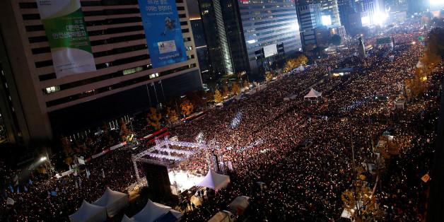 People take part in a rally calling for President Park Geun-hye to step down in central Seoul, South Korea, November 12, 2016. REUTERS/Kim Hong-Ji