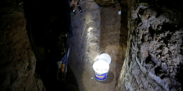 A member of Peshmerga forces inspects a tunnel used by Islamic State militants in the town of Bashiqa, after it was recaptured from the Islamic State, east of Mosul, Iraq, November 12, 2016. REUTERS/Azad Lashkari