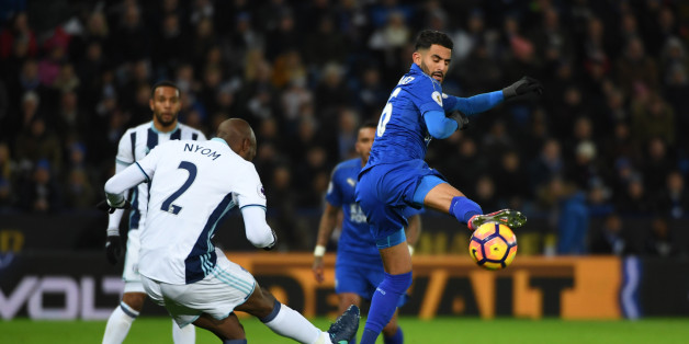 LEICESTER, ENGLAND - NOVEMBER 06: Allan Nyom of West Bromwich Albion clears as Riyad Mahrez of Leicester City blocks during the Premier League match between Leicester City and West Bromwich Albion at The King Power Stadium on November 6, 2016 in Leicester, England. (Photo by Ross Kinnaird/Getty Images)