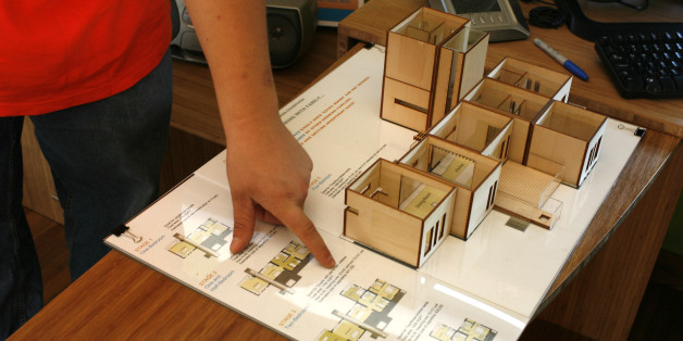 The solar powered home built and designed by the University of Illinois at Urbana-Champaign show the design model during a tour at the "Powered by the Sun 2007 Solar Decathlon" on the National Mall in Washington, Saturday, Oct. 13, 2007. (AP Photo/Lawrence Jackson)