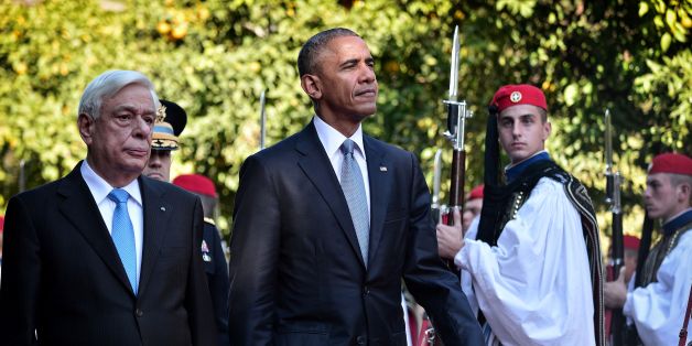 US President Barack Obama and his Greek couterpart Prokopis Pavlopoulos (L) review a presidential honour guard durig the official welcoming ceremony at the presidental palace in Athens on November 15, 2016.
Obama flew into Athens on his final foreign trip to Europe, seeking to calm the nerves of allies concerned by Donald Trump's shock presidential election victory. / AFP / LOUISA GOULIAMAKI (Photo credit should read LOUISA GOULIAMAKI/AFP/Getty Images)