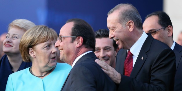 WARSAW, POLAND - JULY 8: German Chancellor Angela Merkel, President of France Froncois Hollande (C) and Turkish President Recep Tayyip Erdogan chat during the Warsaw NATO Summit on July 8, 2016 in Warsaw, Poland. (Photo by Dursun Aydemir/Anadolu Agency/Getty Images)