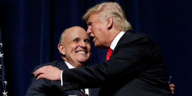 Republican presidential nominee Donald Trump embraces former New York City Mayor Rudolf Giuliani at a campaign rally in Greenville, North Carolina, U.S., September 6, 2016. REUTERS/Mike Segar