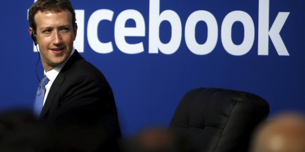 Facebook CEO Mark Zuckerberg is seen on stage during a town hall at Facebook's headquarters in Menlo Park, California September 27, 2015. Picture taken February 27, 2015. REUTERS/Stephen Lam/File Photo