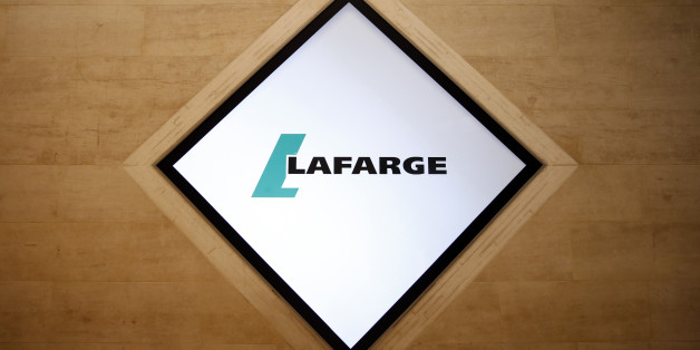 The company logo of Lafarge is pictured during the group's shareholders meeting in Paris, France, May 7, 2015. Holcim Ltd, a Swiss company, and Lafarge S.A., which is based in Paris, on Monday won U.S. antitrust approval to merge after they agreed to divest assets, the Federal Trade Commission. The companies agreed to divest plants, terminals and a quarry to gain approval of their $25 billion deal, the FTC said. REUTERS/Benoit Tessier