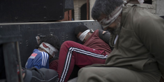 Men accused of being Islamic State militants ride on the back of an Iraqi special forces armored vehicle after being captured in Mosul, Iraq, Wednesday, Nov. 16, 2016. Troops have established a foothold in the city's east from where they are driving northward into the Tahrir neighborhood. The families in Tahrir are leaving their homes to flee the fighting. (AP Photo/Felipe Dana)