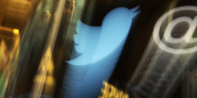 FILE - In this Wednesday, Nov. 6, 2013, file photo, the Twitter logo appears on an updated phone post on the floor of the New York Stock Exchange. Twitter reports financial results Thursday, Oct. 27, 2016. (AP Photo/Richard Drew, File)