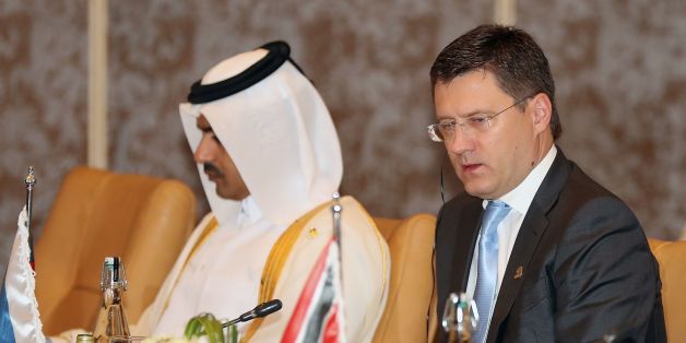 Russian Energy Minister Alexander Novak (R) attends the 18th Ministerial Meeting of the Gas Exporting Countries Forum (GECF) in the capital Doha on November 17, 2016. / AFP / KARIM JAAFAR (Photo credit should read KARIM JAAFAR/AFP/Getty Images)