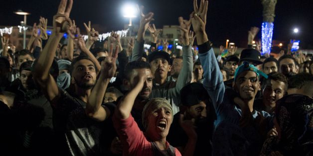Protesters shout slogans in the northern Moroccan city of Al Hoceima on October 30, 2016, following the death of fishmonger Mouhcine Fikri, who was crushed to death on October 28 in a rubbish truck in Al Hoceima, as he reportedly tried to protest against a municipal worker seizing and destroying his wares. Thousands of Moroccans on October 30 attended the funeral of the fishmonger whose gruesome death in a rubbish truck crusher has caused outrage across the North African country. An image of hi