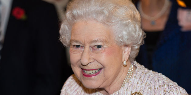 Britain's Queen Elizabeth II unveils a portrait of herself by artist Colin Davidson, during a Co-operation Ireland reception at Crosby Hall in London, Tuesday, Nov. 8, 2016. (Jeff Spicer/Pool Photo via AP)