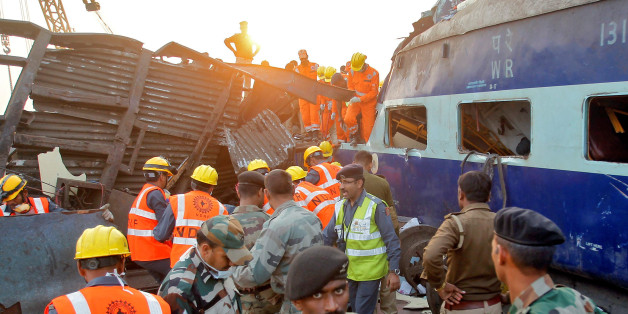 Rescue workers search for survivors at the site of a train derailment in Pukhrayan, south of Kanpur city, India November 20, 2016. REUTERS/Jitendra Prakash