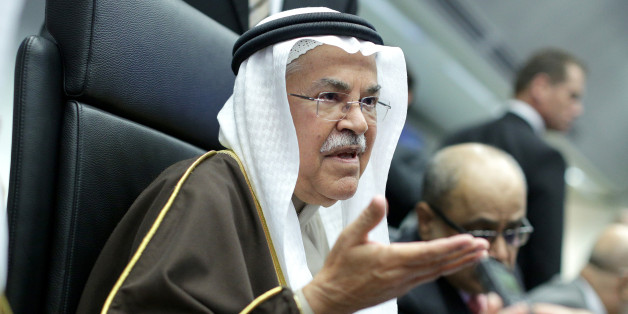 Ali Bin Ibrahim al-Naimi, Saudi Arabia's petroleum and mineral resources minister, gestures as he speaks to journalists ahead of the 168th Organization of Petroleum Exporting Countries (OPEC) meeting in Vienna, Austria, on Friday, Dec. 4, 2015. Oil headed for its fourth decline in five weeks as the Organization of Petroleum Exporting Countries looked set to leave its production ceiling unchanged at a meeting in Vienna on Friday. Photographer: Lisi Niesner/Bloomberg via Getty Images