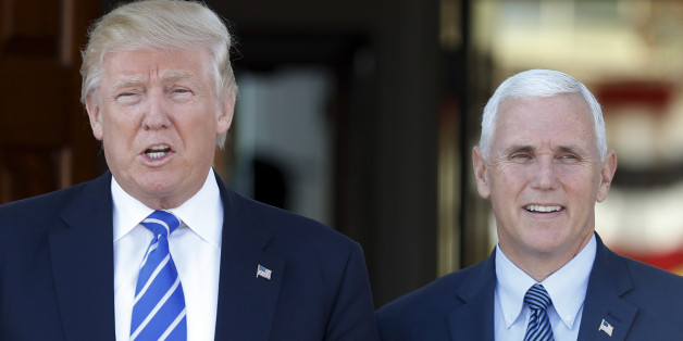 President-elect Donald Trump and Vice President-elect Mike Pence pause for photographs as they arrive at the Trump National Golf Club Bedminster clubhouse in Bedminster, N.J., Saturday, Nov. 19, 2016. (AP Photo/Carolyn Kaster)