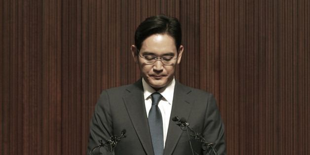 Lee Jae-yong, the heir of the Samsung business empire, reacts during a press conference at the company's headquarters in Seoul, South Korea, Tuesday, June 23, 2015. Lee bowed deep in apology Tuesday as criticism mounted over a Samsung hospital's role in spreading Middle East respiratory syndrome in South Korea. (AP Photo/Ahn Young-joon)