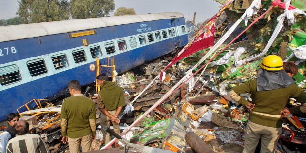 Rescue workers search for survivors at the site of a train derailment in Pukhrayan, south of Kanpur city, India November 20, 2016. REUTERS/Jitendra Prakash