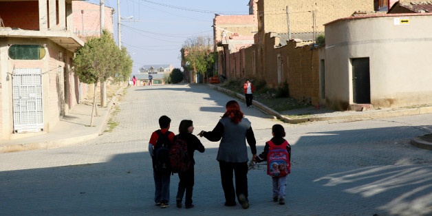 Pamela Flores, a lesbian mother, and her children walk to school in the El Alto outskirts of La Paz, Bolivia, September 23, 2016.REUTERS/David Mercado