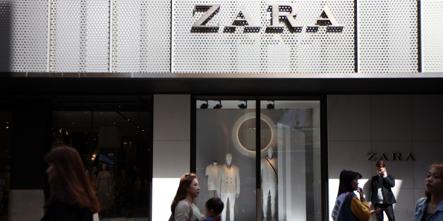 Pedestrians and shoppers walk past a Zara fashion store, operated by Inditex SA, in the Myeongdong shopping district of Seoul, South Korea, on Friday, April 17, 2015. South Korea is scheduled to release gross domestic product (GDP) figures on April 23. Photographer: Woohae Cho/Bloomberg via Getty Images