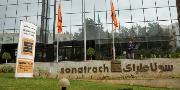 An employee stands near the headquarter of the state energy company Sonatrach in Algiers, Algeria june 26, 2016.Reuters/Ramzi Boudia
