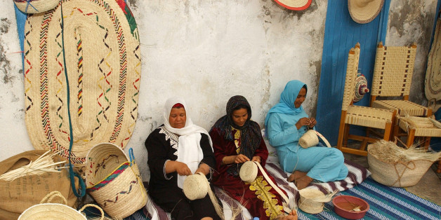 **FILE** Women make baskets in Gabes, south of Tunis, in this May 2006 file photo. As Tunisia celebrates the 50th anniversary of a revolutionary law that gave women some of the same rights as men, many women's rights advocates warn that the 1956 text needs urgent updating, especially its section on inheritance law.(AP Photo/Hassene Dridi)