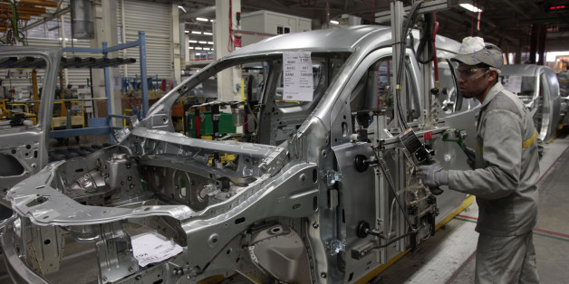 An employee works at the assembly line of Dacia Sandero cars at a factory operated by Somaca in Tangiers, February 21, 2013. Somaca is part of an expanding web of car makers and parts suppliers in Morocco, a heavily agricultural country which hopes to use the auto sector to expand its industrial base. A strong auto industry, exporting cars to Europe, North Africa and further afield, could help to resolve one of the country's main economic weaknesses, its external deficits. Morocco posted a trade
