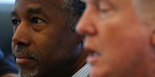 Dr. Ben Carson (L) and Republican presidential nominee Donald Trump speak during a round table with the Republican Leadership Initiative at Trump Tower in the Manhattan borough of New York, U.S., August 25, 2016. REUTERS/Carlo Allegri