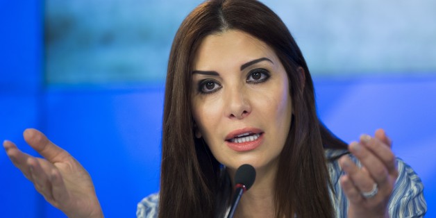 Franco-Syrian politician and leading figure of opposition to the Syrian government, Randa Kassis, gestures while speaking during a press conference in Moscow, Russia, Thursday, Nov. 19, 2015. (AP Photo/Alexander Zemlianichenko)