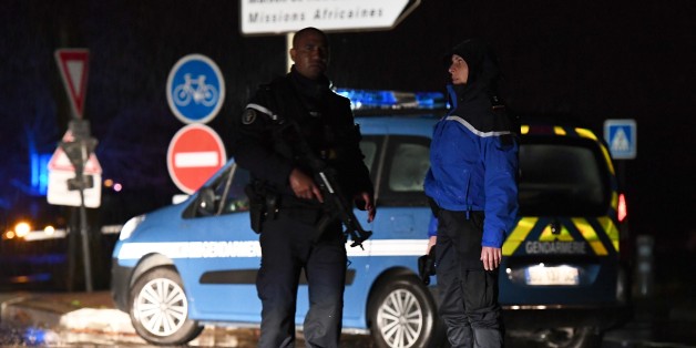 Gendarmes stand guard on a road near a retirement home for monks in Montferrier-sur-Lez, southern France, early on November 25, 2016, after an armed man burst in the home killing a woman with a knife.Armed police were hunting the man inside the home, which is home to around 70 men and women who have served as missionaries in Africa. Authorities said it was a 'criminal act'. / AFP / PASCAL GUYOT (Photo credit should read PASCAL GUYOT/AFP/Getty Images)
